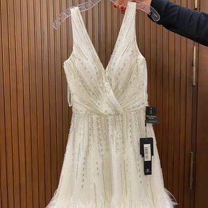 Brand New Beaded dress. Size 10, runs small.